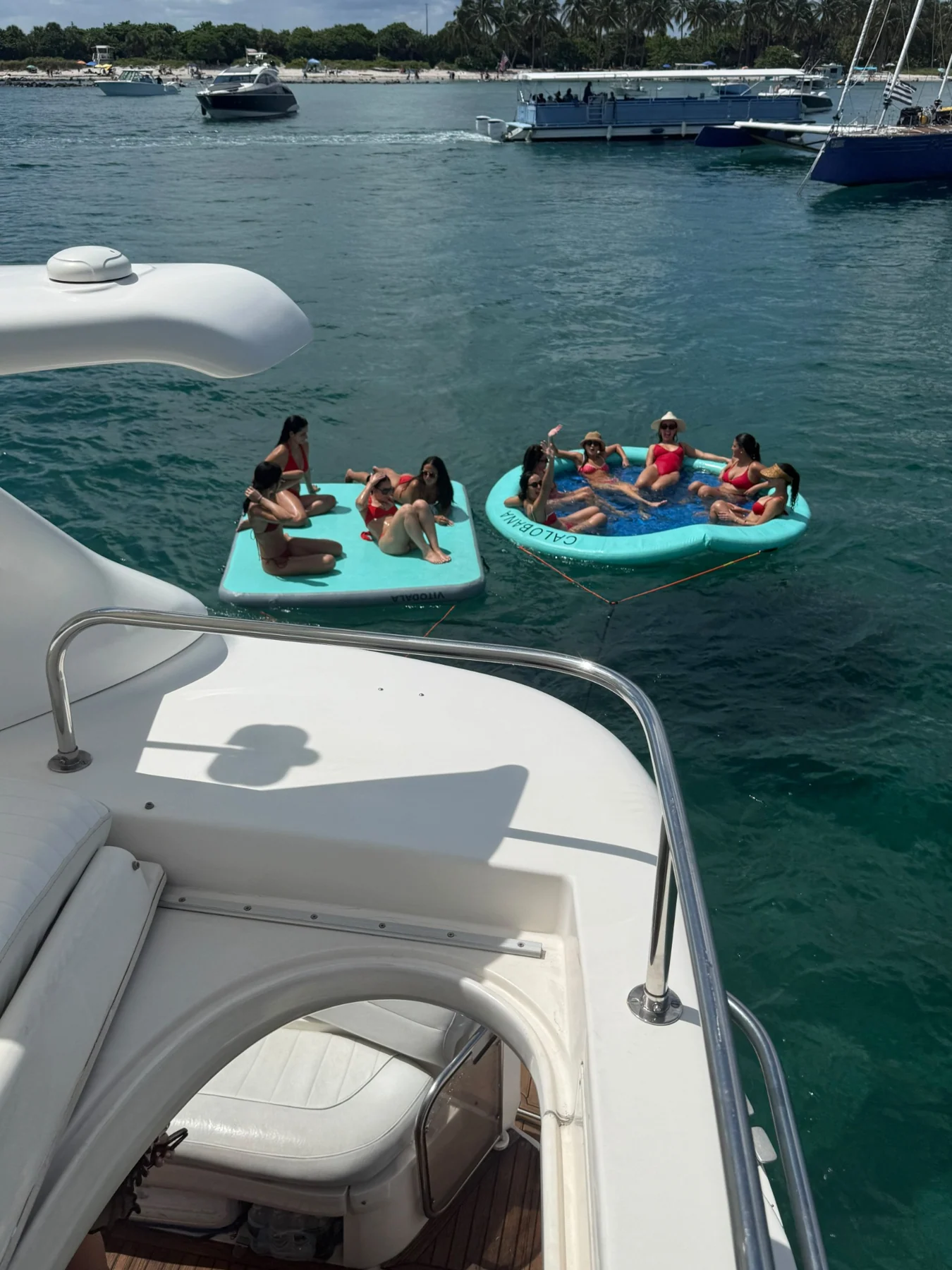 View from the boat toward guests relaxing on floats