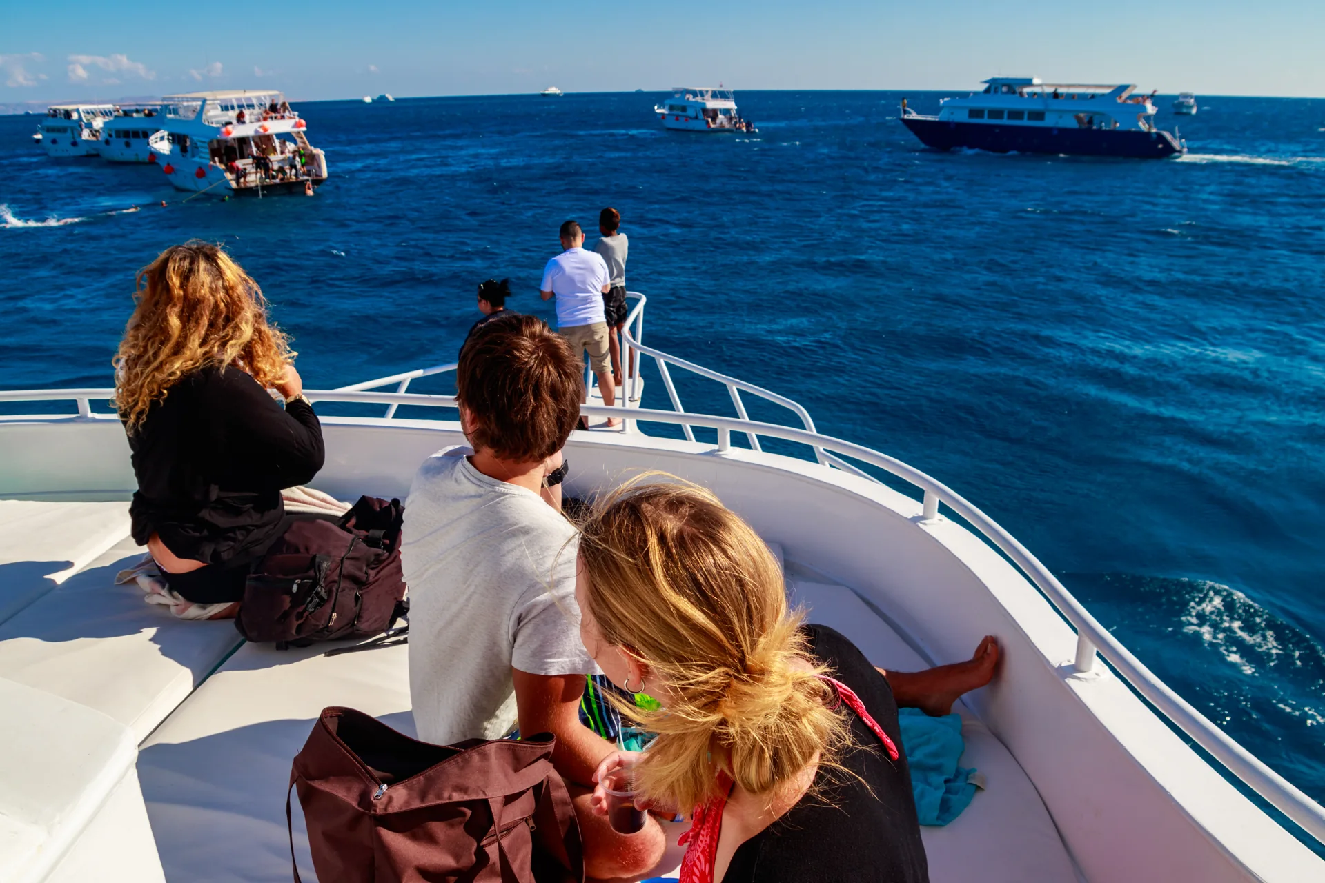 Friends spending time together on the bow of a boat